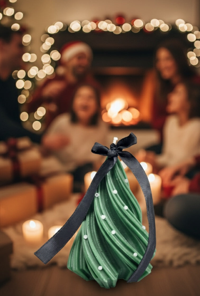 Green bag with a black ribbon in front of a blurred festive background with people and lights.
