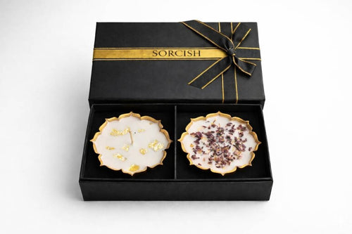 Two decorative plates in a black box with gold ribbon, branded 'Sorcish'.