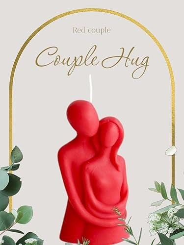 Red candle shaped like a couple hugging with decorative elements on a light background