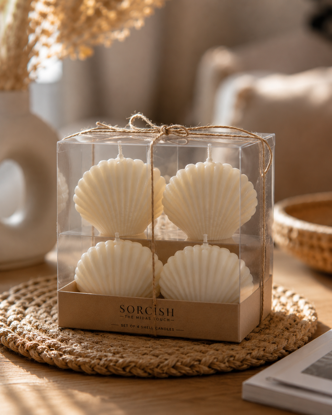 Pack of 4 seashell-shaped soy wax candles, 2-inch, arranged on a coastal-themed display