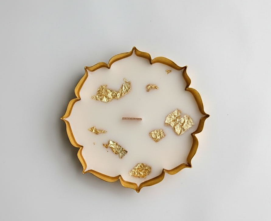 Decorative plate with gold leaf on a white background